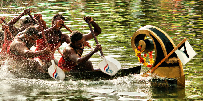Oarsmen Rowing a Snake Boat